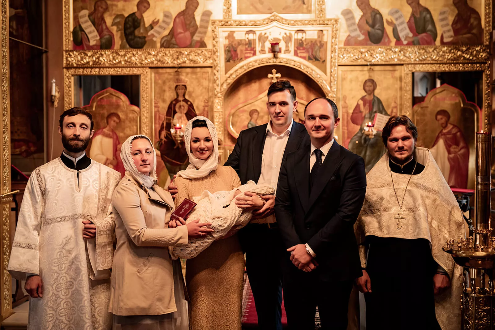 Family and clergy gathered for a portrait after the christening